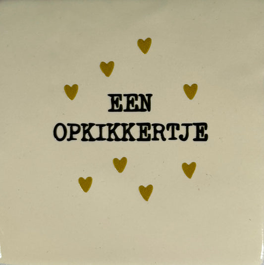 Quote tegeltje 'een opkikkertje' creme/zwart