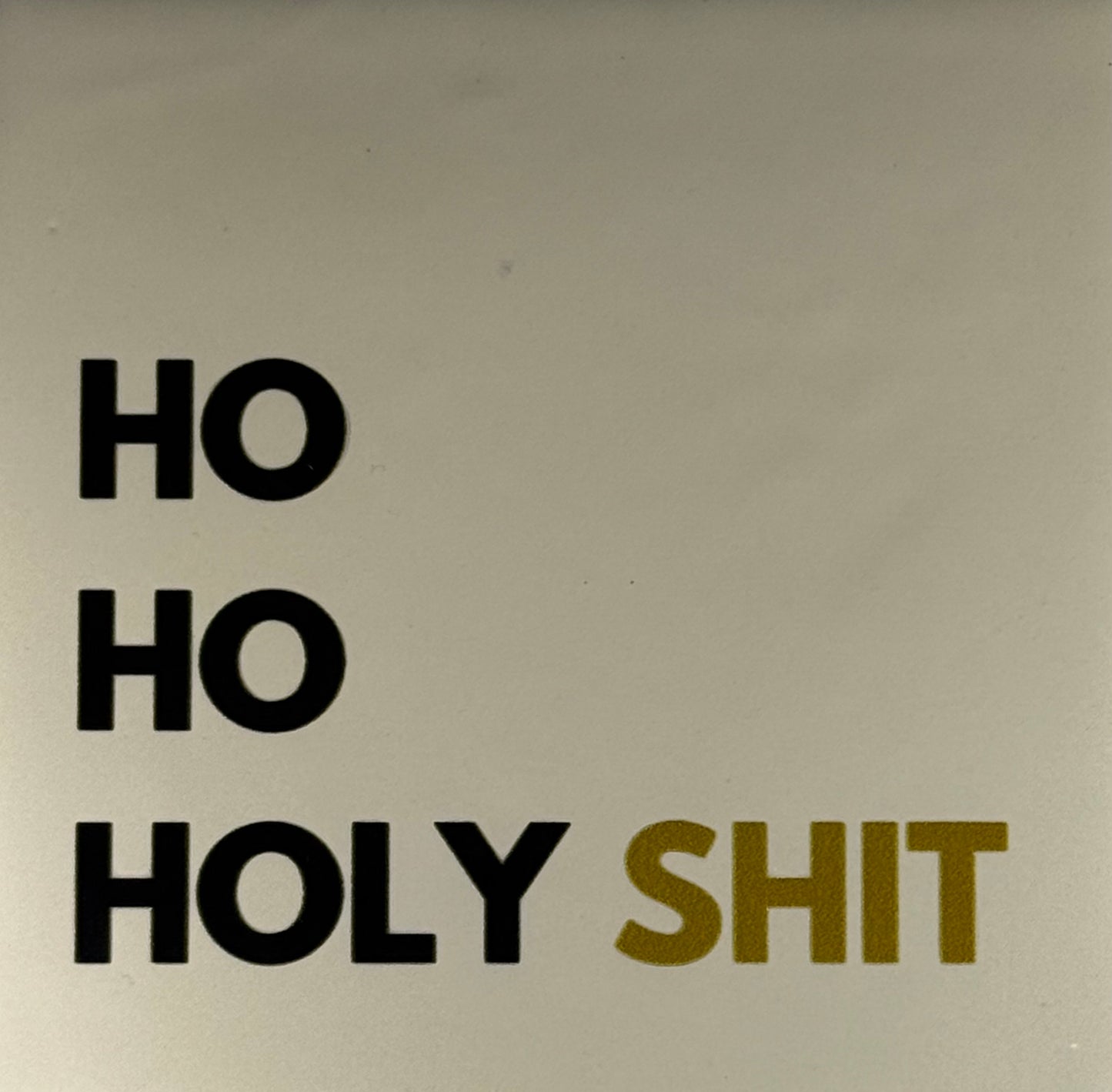 Quote tegeltje 'ho ho holy shit' creme/zwart(goud)