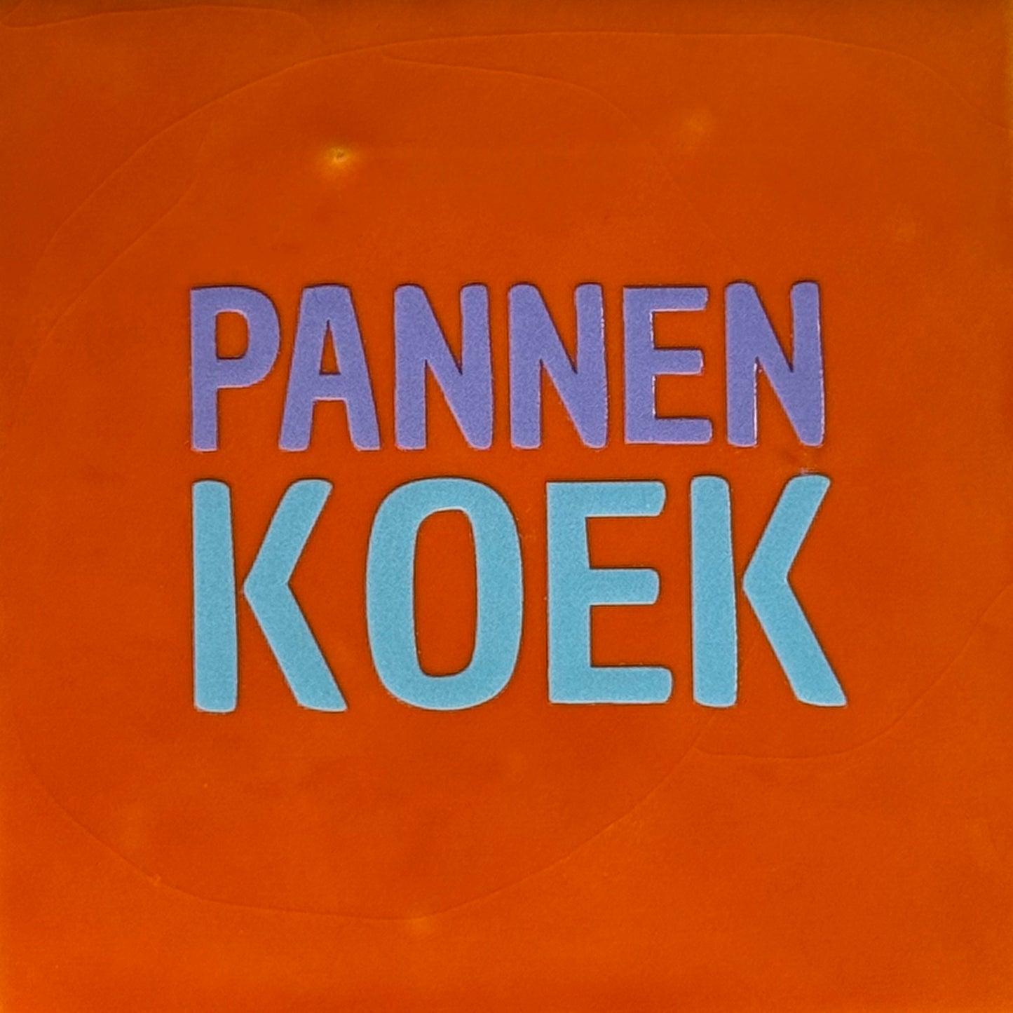 Quote tegeltje 'pannenkoek' oranje/lila(warmblauw)