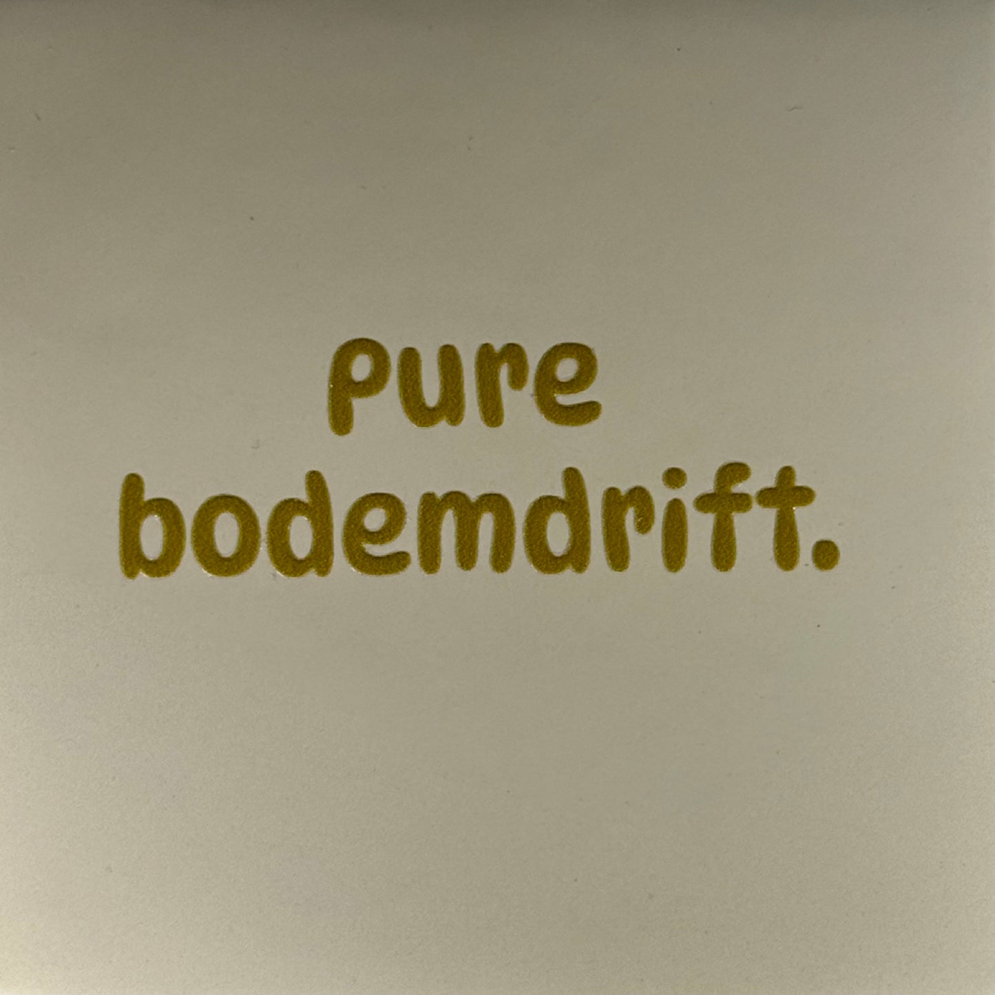 Quote tegeltje 'pure bodemdrift' creme/goud