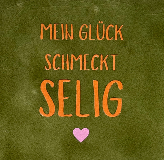 Quote tegeltje 'Mein glück schmeckt selig' olijf/oranje(warmroze)