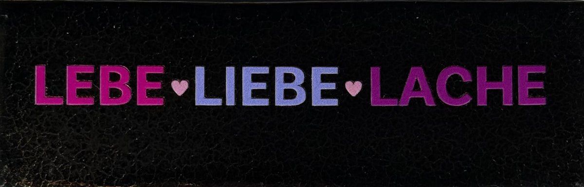 Quote tegeltje DO 'lebe liebe lache' goud/knalroze(lila-paars-warmroze)